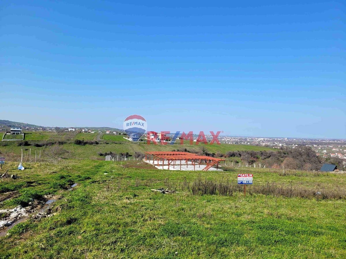 REMAXKUZEYSEVCAN GÜRLEVİKTEN TAŞKELİKTE DENİZ MANZARALI SATILIK VİLLA ARSASI
