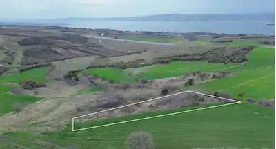BOĞAZ MANZARALI FIRSAT! LAPSEKI SULUCA'DA 1.622 M² MÜSTAKIL PARSEL YATIRIMLIK TARLA