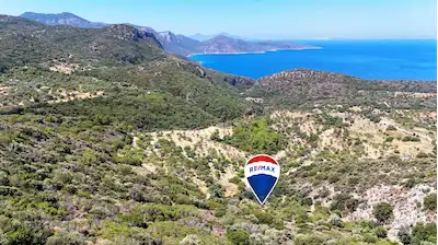DATÇA CUMALI MAHALLESİNDE SATILIK DENİZ GÖREN TARLA