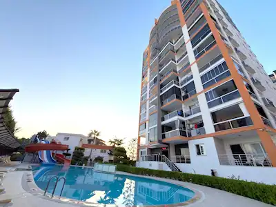 REMAX TOROS'TAN ERDEMLİ KARGIPINARI’NDA DENİZ MANZARALI EŞYALI 1+1 