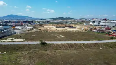 TUZLA ORHANLI'DA DEPOLAMA ALANI FONKSİYONLU 3.117 M² İMARLI ARSA