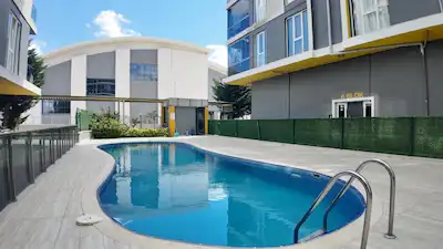 REMAX LAND'DEN SITE IÇINDE DOĞU-GÜNEY CEPHELİ, BOŞ VE KREDİYE UYGUN 2+1 DAİRE