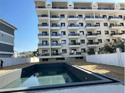 DENIZE YÜRÜME MESAFESİNDE FULL AKTİVİTELİ SİTEDE 1+1