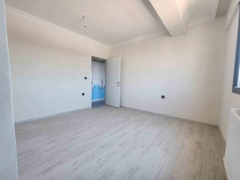 SIFIR 2+1 ARA KAT AÇIK MUTFAKLI MERKEZİ KONUMDA