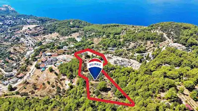FETHİYE FARALYA’DA PANORAMİK DENİZ MANZARALI, TURİZM İMARLI SATILIK ARSA