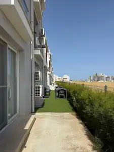 LONG BEACH'TE EŞYALI 1+1 BAHÇELI DAIRE NOYANLAR ROYAL SUN ELIT