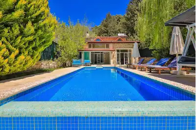 KAŞ SARIBELEN'DE (KALKAN) TURIZM BELGELI 2+1 SATILIK VILLA